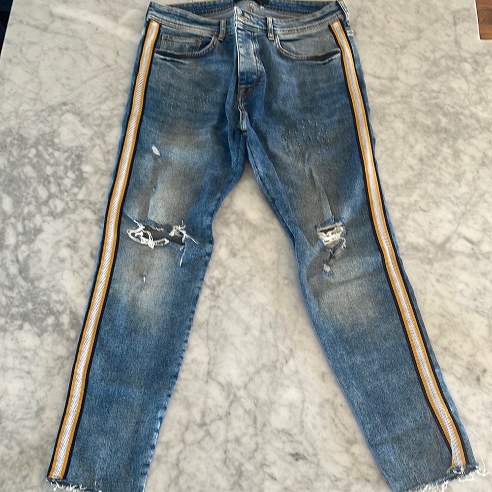 Zara denim with navy, white, yellow trim. Slim fit, rough cut ankle openings.